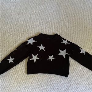 Black star partially cropped sweater